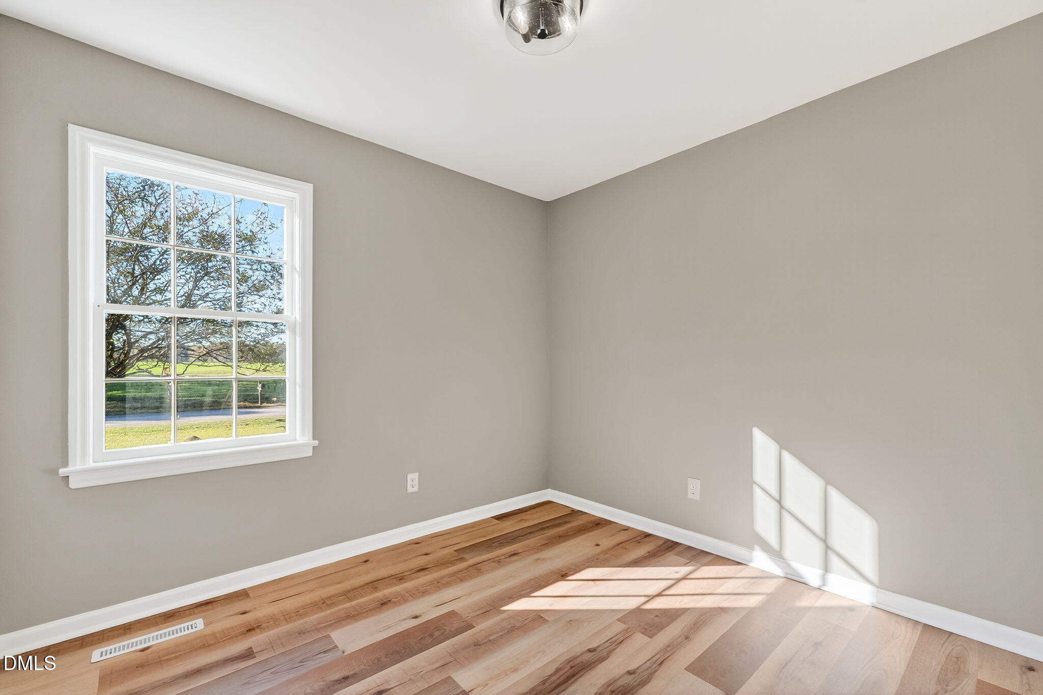 505 Pineview Road Kenly, NC 27542 - Photo 14 of 35 a view of a room with wooden floor and a window