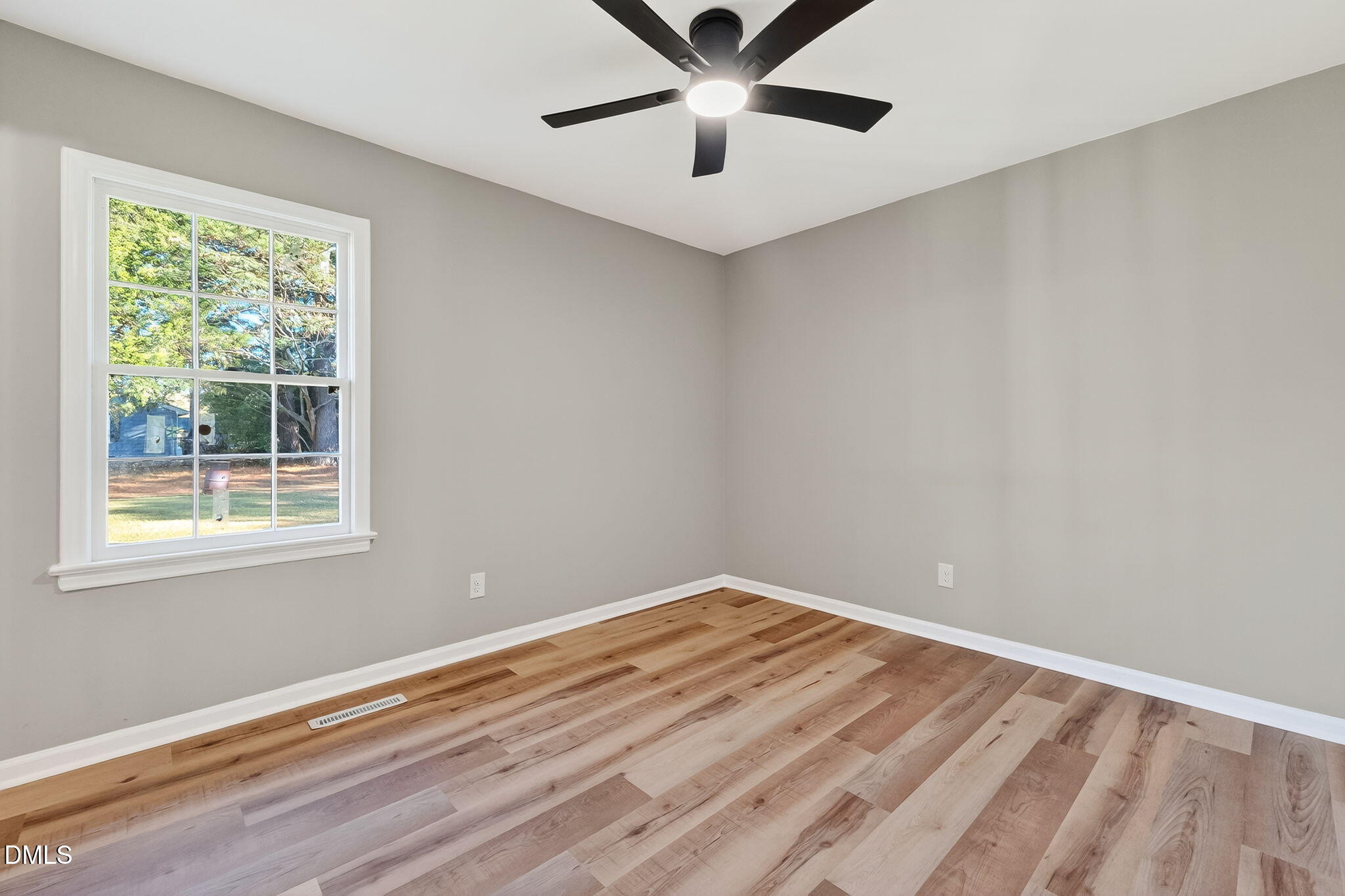 505 Pineview Road Kenly, NC 27542 - Photo 20 of 35 a view of a big room with wooden floor and windows