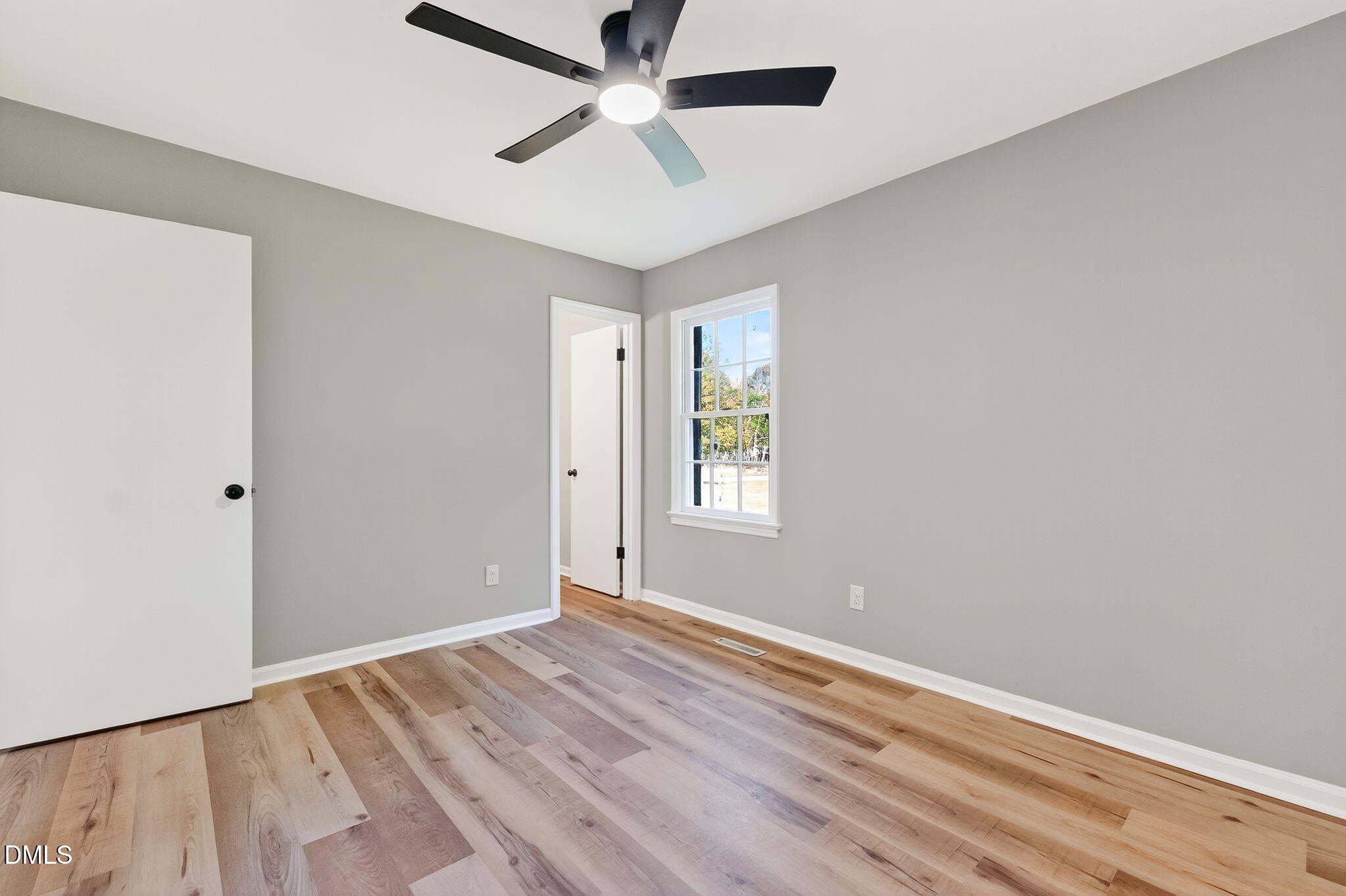 505 Pineview Road Kenly, NC 27542 - Photo 21 of 35 wooden floor in an empty room with a window