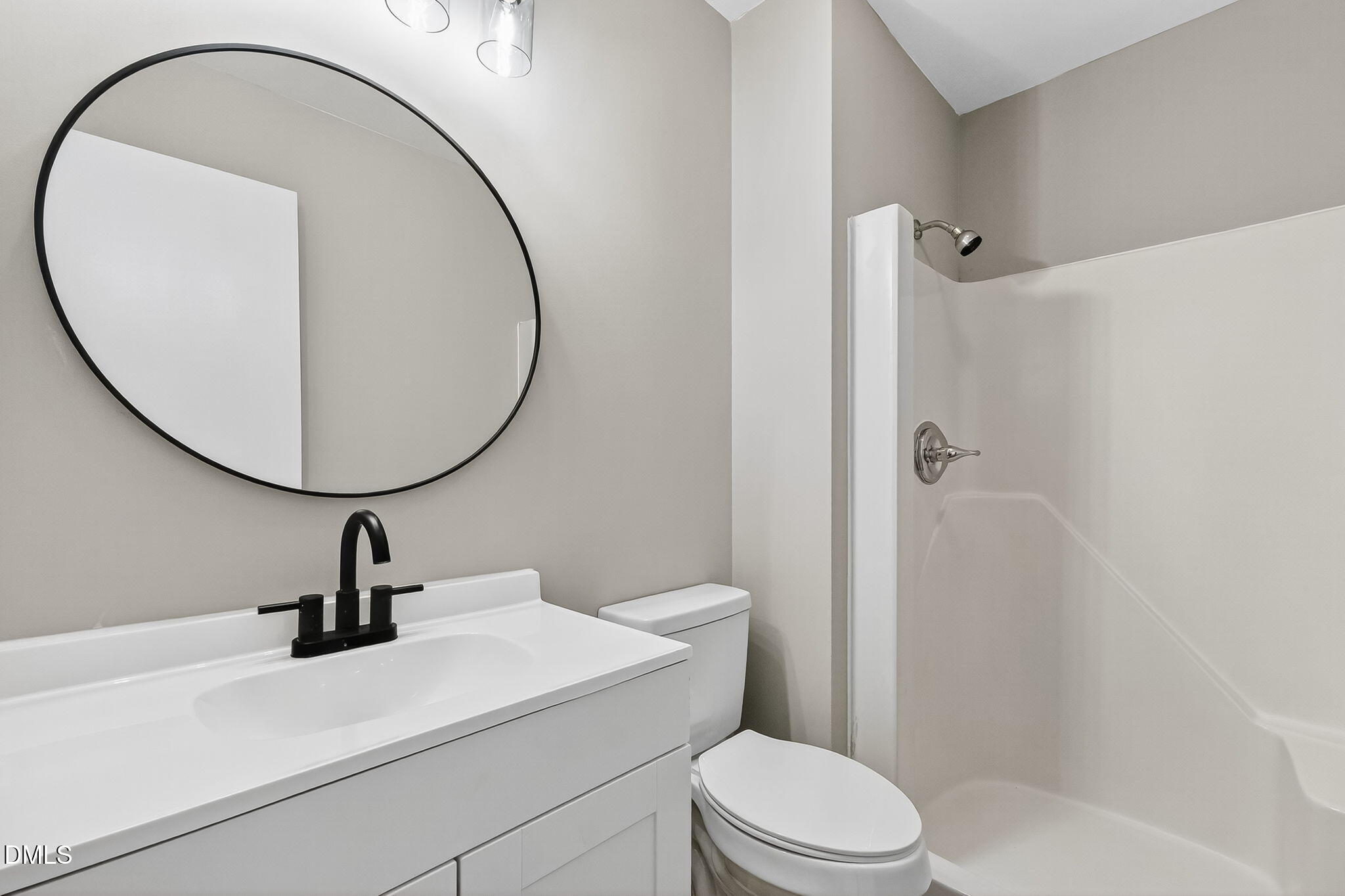 505 Pineview Road Kenly, NC 27542 - Photo 23 of 35 a bathroom with a sink a toilet and a mirror