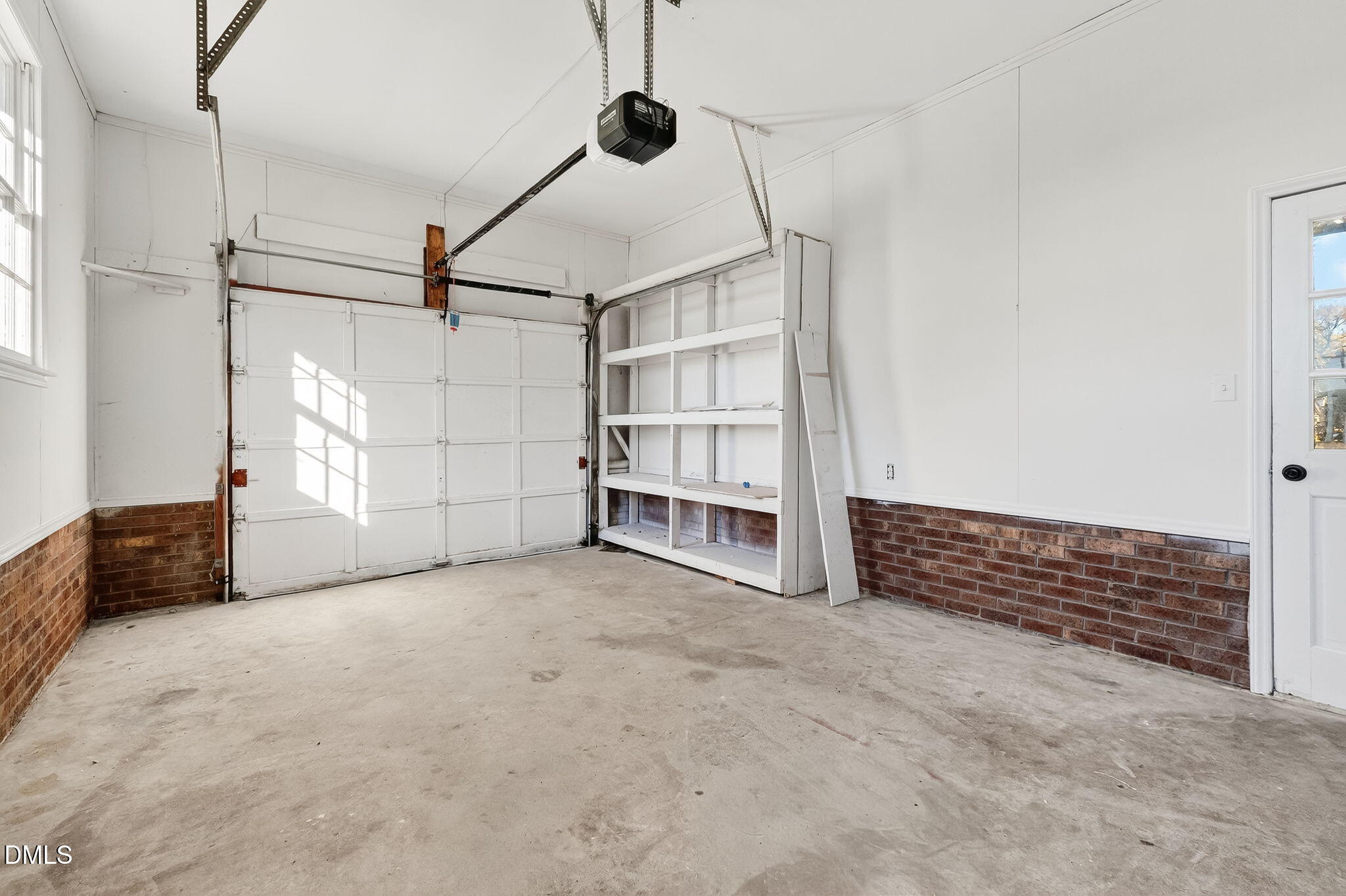 505 Pineview Road Kenly, NC 27542 - Photo 25 of 35 a view of an empty room with cabinet and stairs
