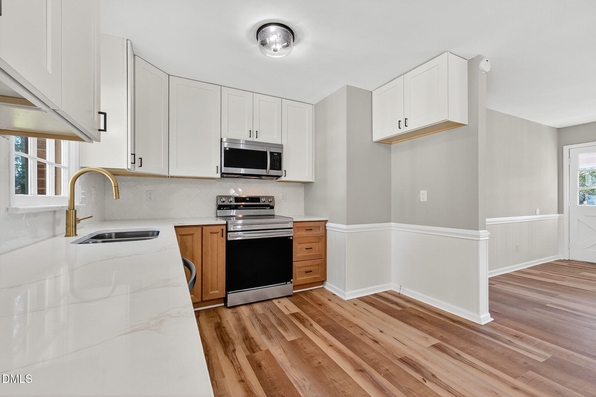 505 Pineview Road Kenly, NC 27542 - Photo 6 of 35 a kitchen with granite countertop a refrigerator and a stove top oven