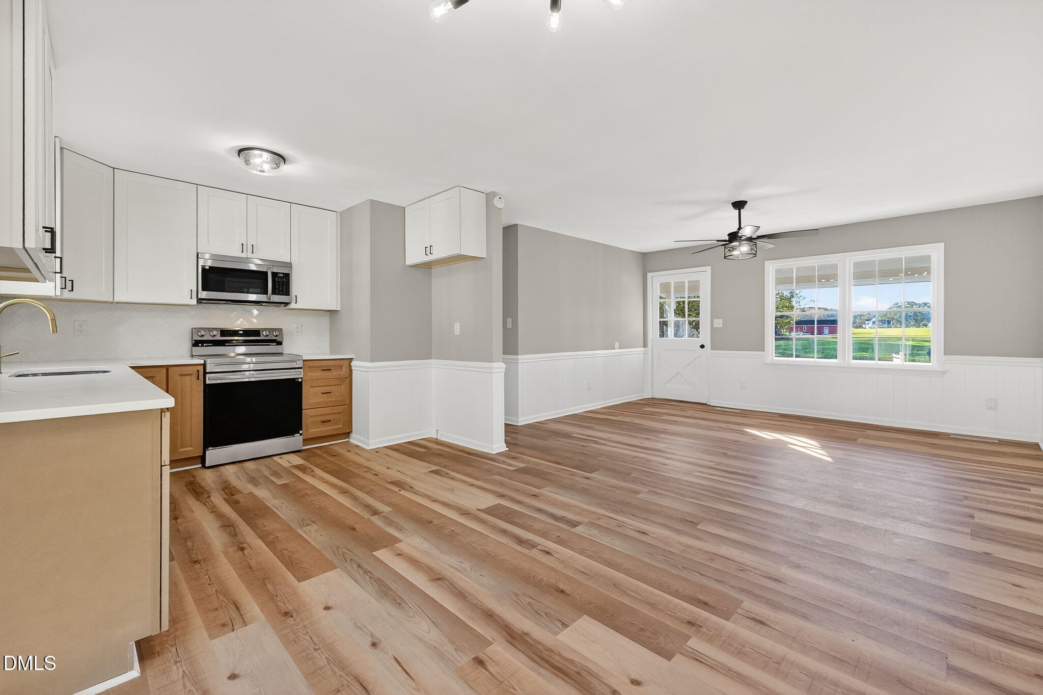505 Pineview Road Kenly, NC 27542 - Photo 7 of 35 a kitchen with granite countertop a stove a sink and a refrigerator