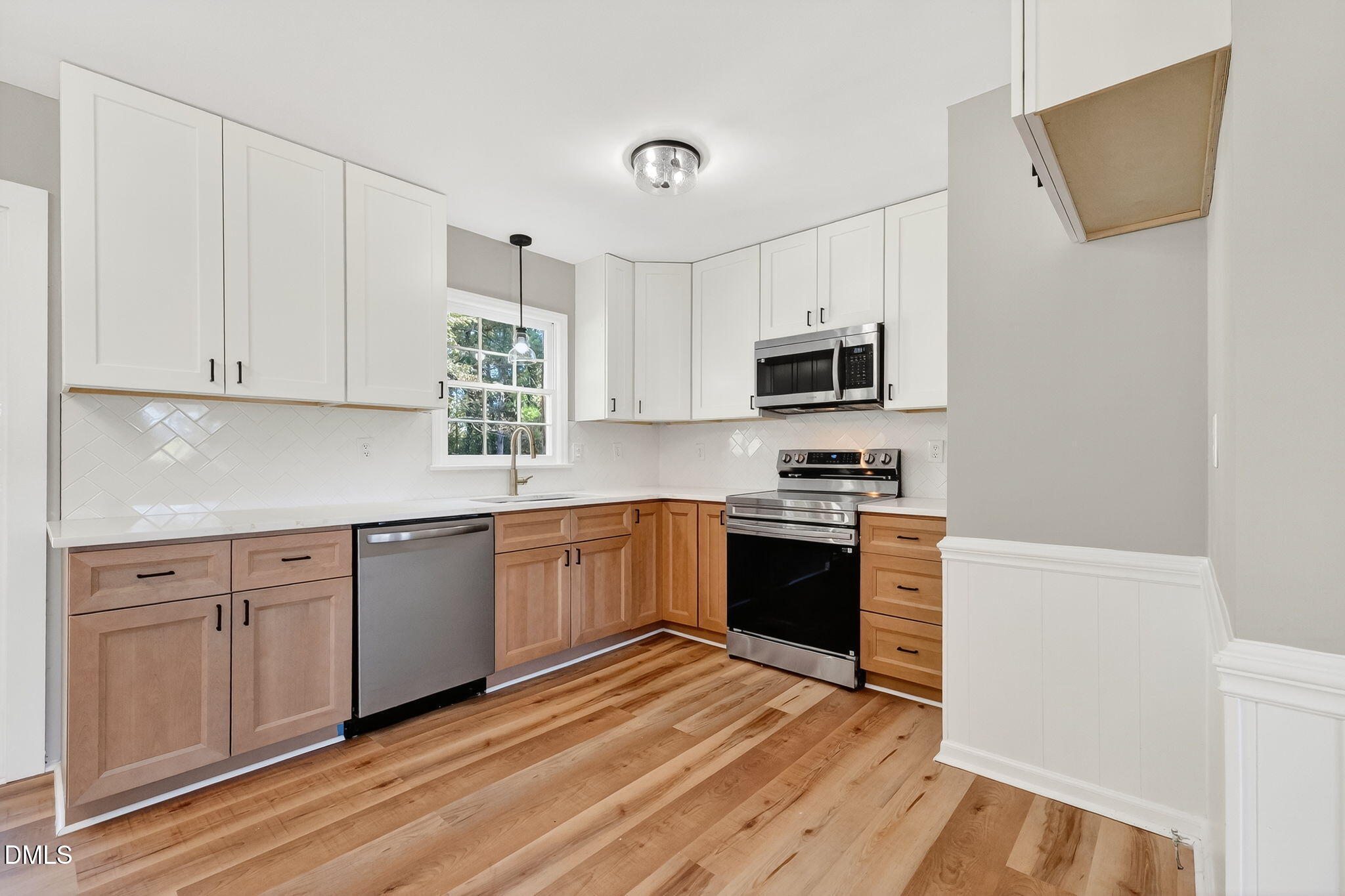 505 Pineview Road Kenly, NC 27542 - Photo 8 of 35 a kitchen with granite countertop a stove top oven sink and cabinets