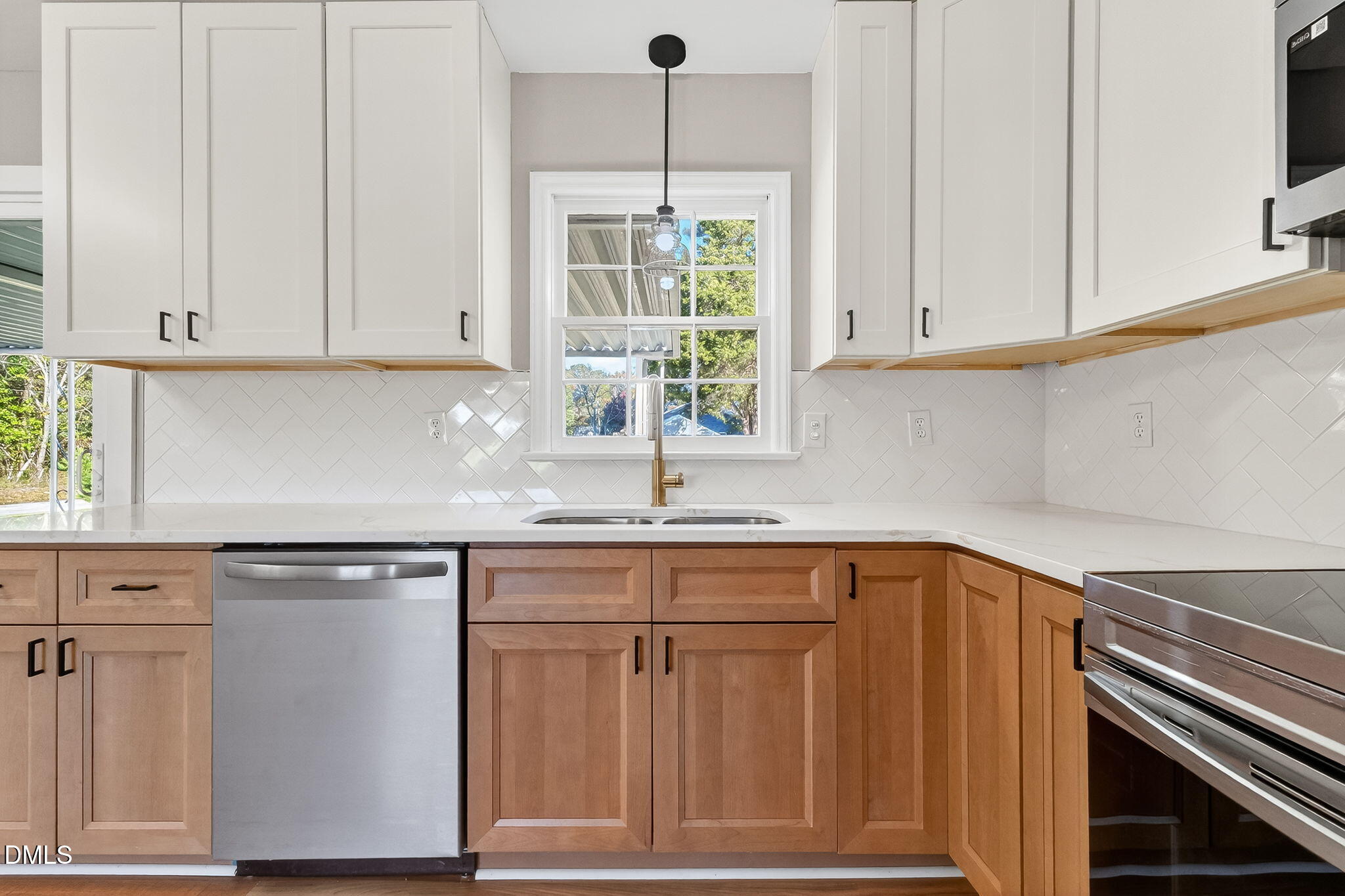505 Pineview Road Kenly, NC 27542 - Photo 9 of 35 a kitchen with stainless steel appliances granite countertop a sink a cabinets and a window