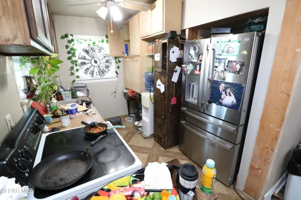 a bedroom with a bed a mirror and desk