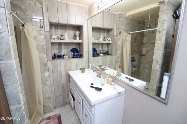 a bedroom with a bed and dresser