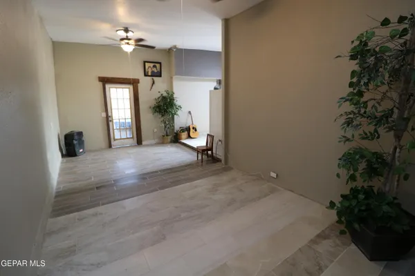 a kitchen with a refrigerator sink stove and cabinets