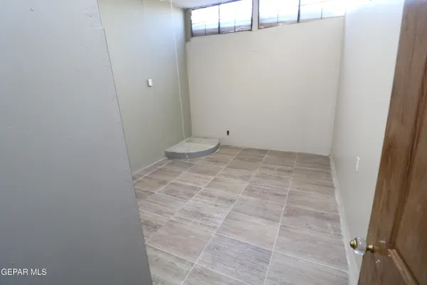 a kitchen with a refrigerator and a sink