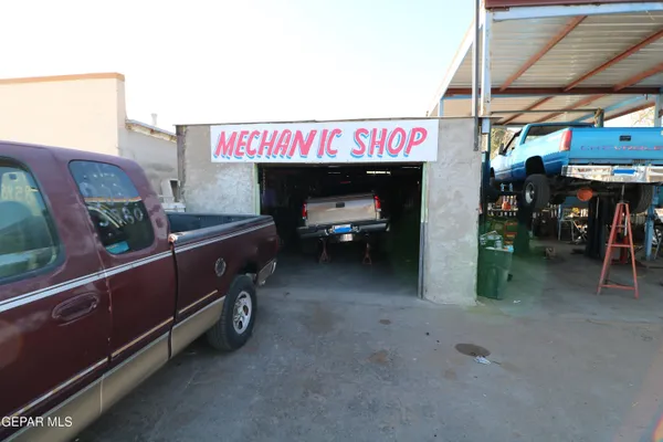 a living room with furniture and a mirror