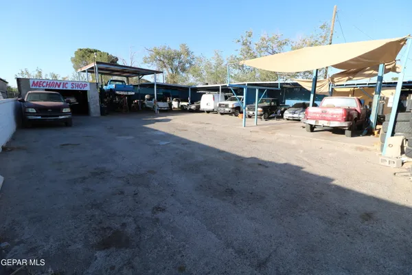 a workspace with furniture and a gate