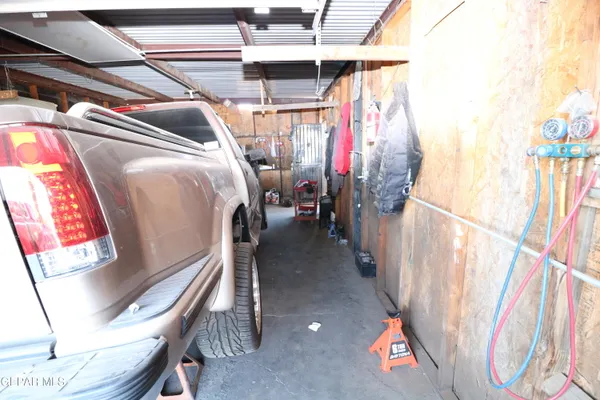 a bathroom with a sink mirror and toilet