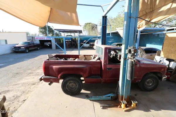 a bathroom with a toilet a sink and a mirror