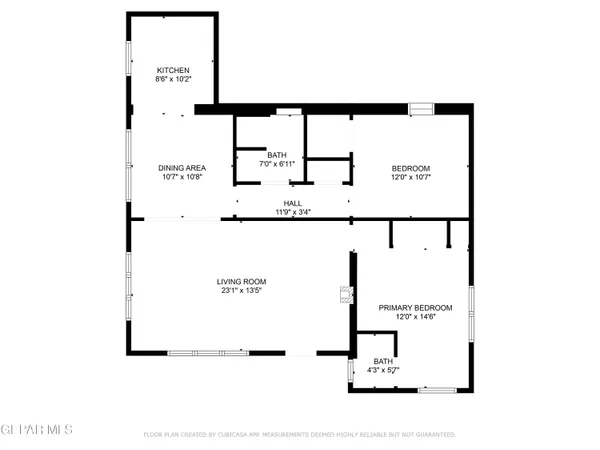 a living room with furniture a mirror and a chandelier