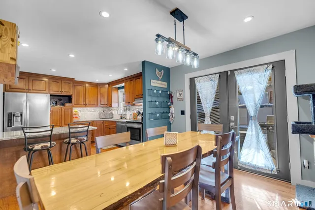 a large kitchen with a table and chairs