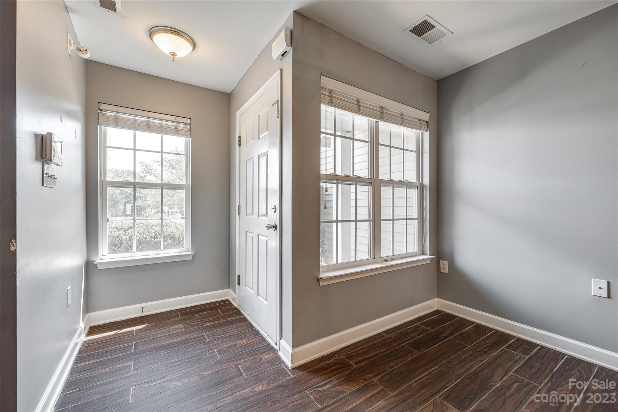 713 Waterfall Way Clover, SC 29710 - Photo 4 of 27 a view of an empty room with wooden floor and a window