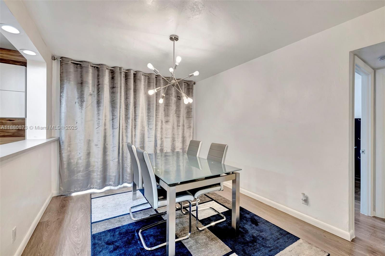 6010 South Falls Cir Drive, Unit 419 Lauderhill, FL 33319 - Photo 16 of 45 a view of a room with furniture and wooden floor