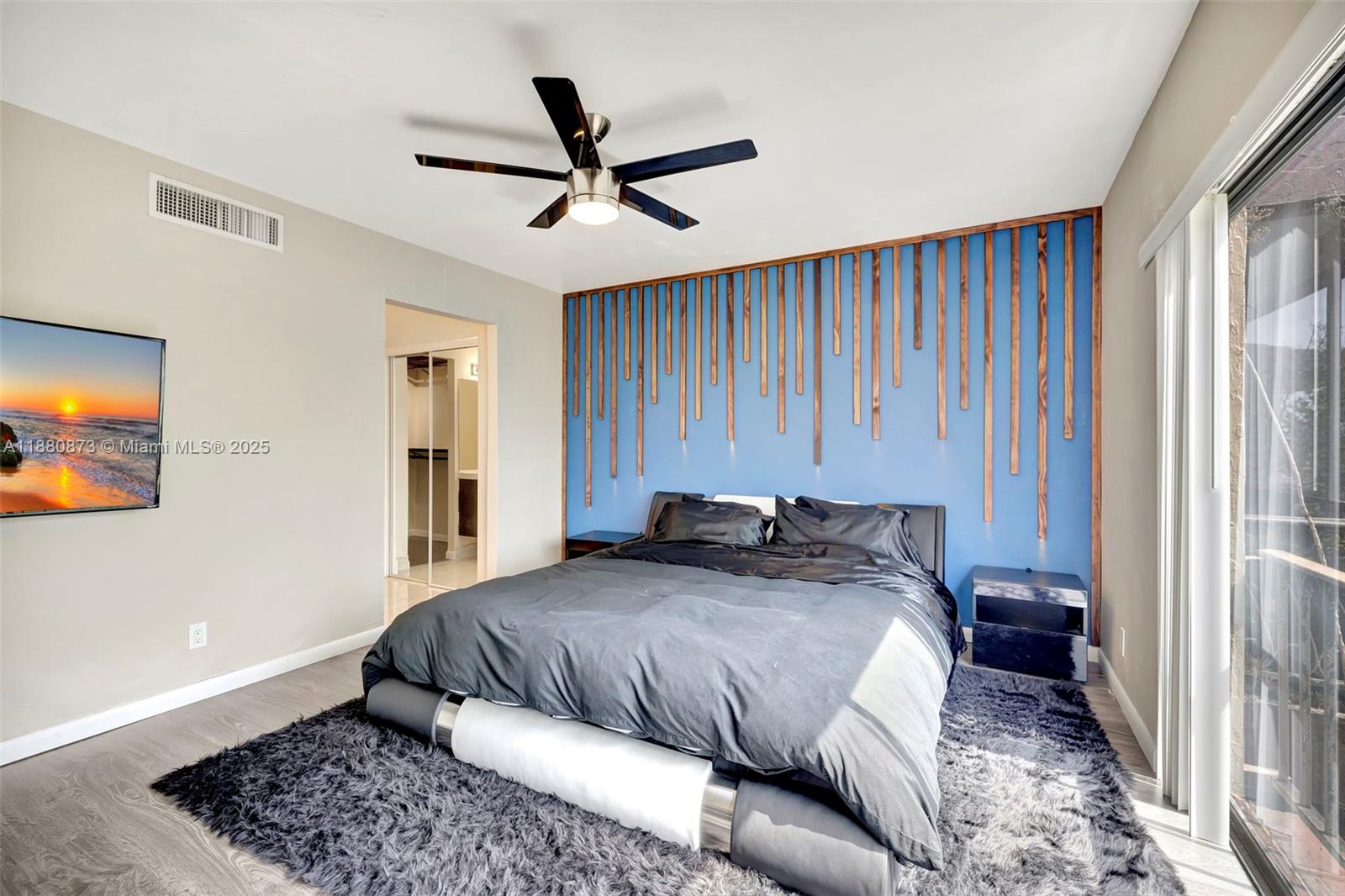 6010 South Falls Cir Drive, Unit 419 Lauderhill, FL 33319 - Photo 17 of 45 a bedroom with a large bed and a window