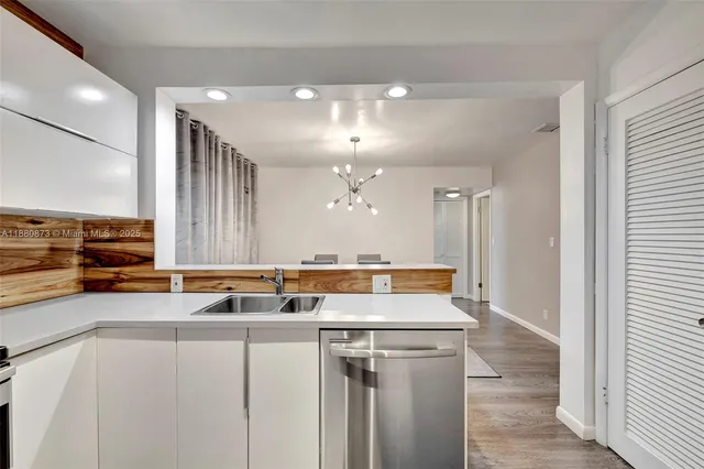 a view of a kitchen with a stove and a dishwasher