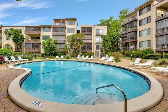 a view of a swimming pool with a patio
