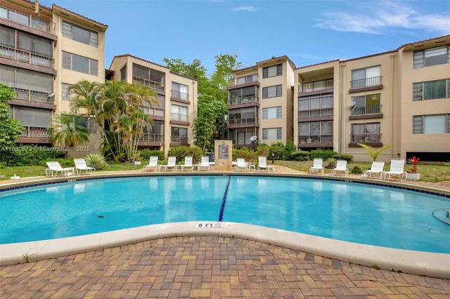a view of a brick building next to a yard