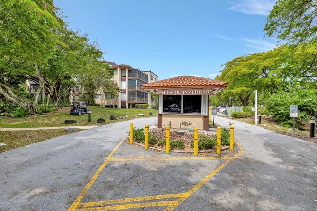 a view of a house with backyard porch and sitting area