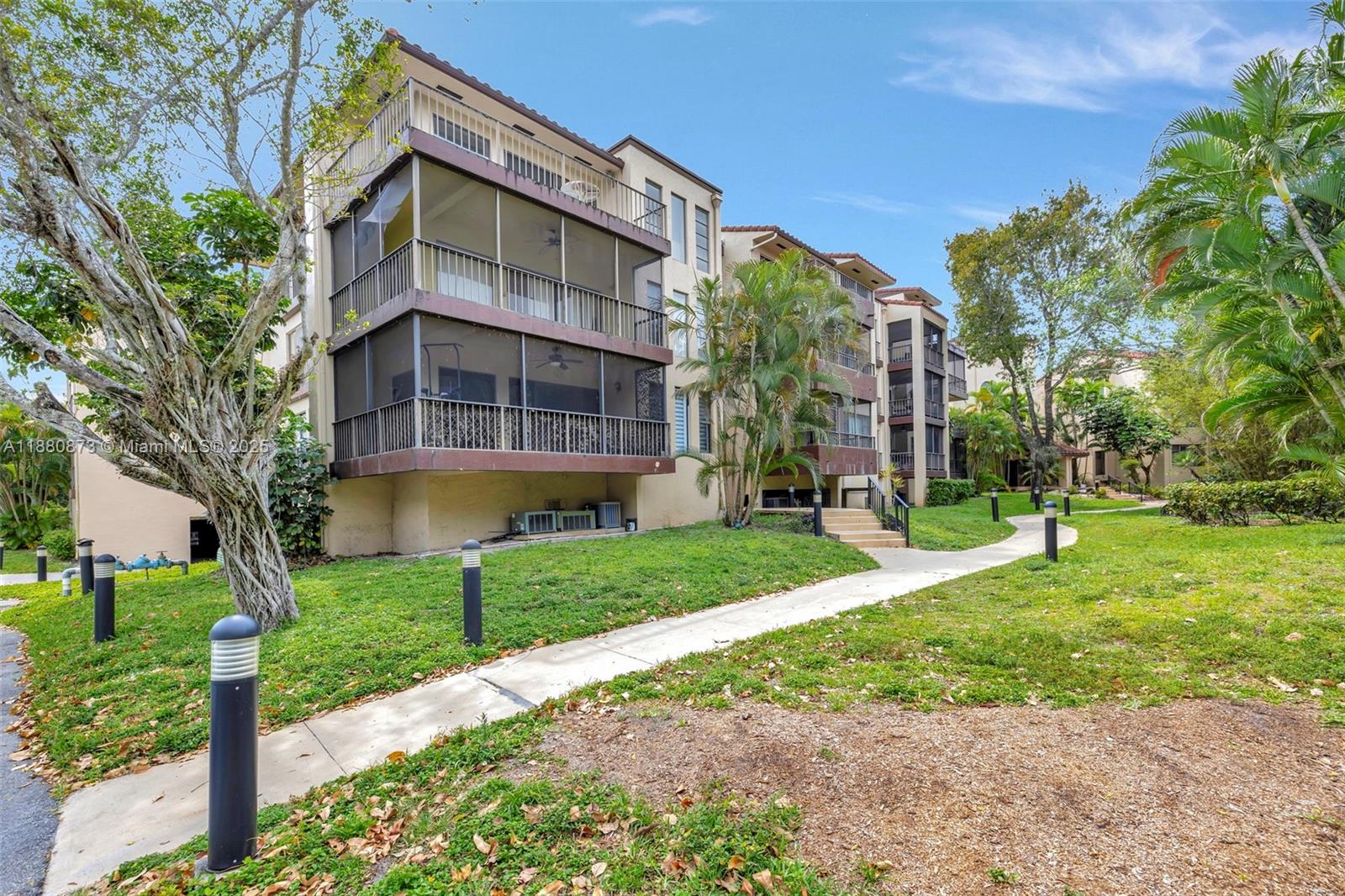 6010 South Falls Cir Drive, Unit 419 Lauderhill, FL 33319 - Photo 29 of 45 front view of a building with a yard