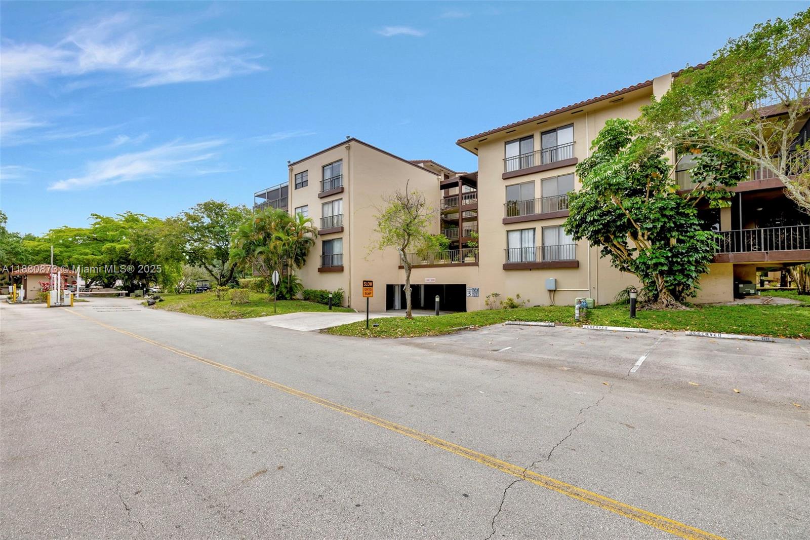 6010 South Falls Cir Drive, Unit 419 Lauderhill, FL 33319 - Photo 43 of 45 a view of a house with a street