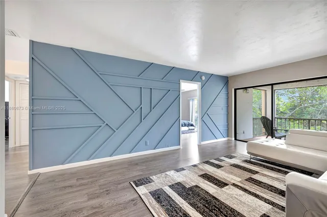 a living room with furniture and a rug