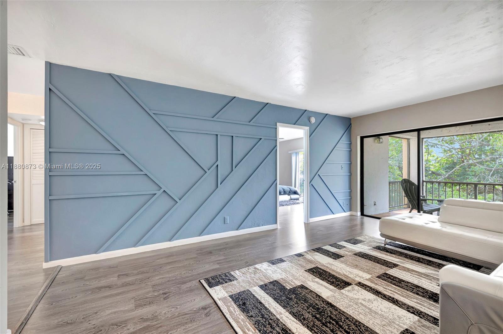 6010 South Falls Cir Drive, Unit 419 Lauderhill, FL 33319 - Photo 5 of 45 a living room with furniture and a rug