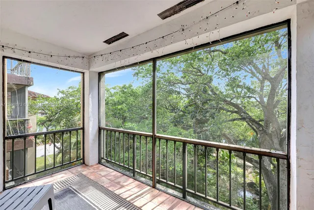 a view of a balcony with wooden floor