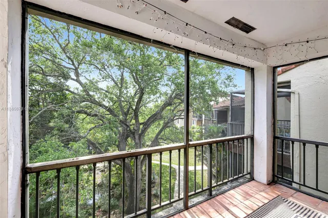 a view of a balcony with wooden floor