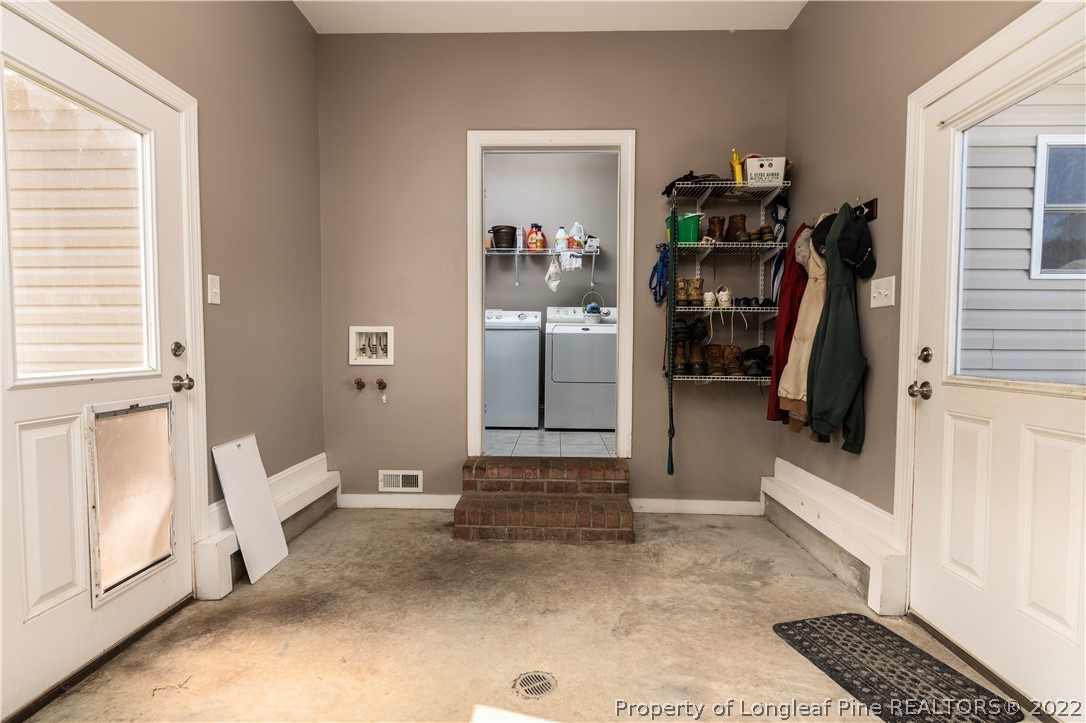 338 Grady Road Cameron, NC 28326 - Photo 27 of 49 a view of a hallway with windows and stairs