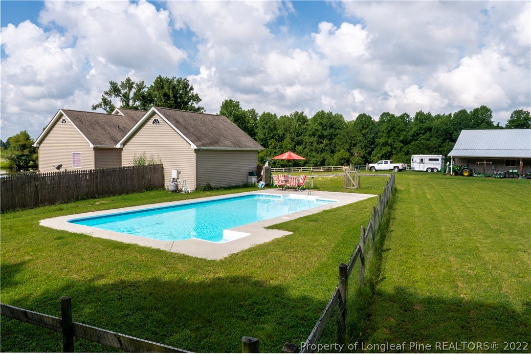 338 Grady Road Cameron, NC 28326 - Photo 4 of 49 a view of an house with swimming pool and mountains