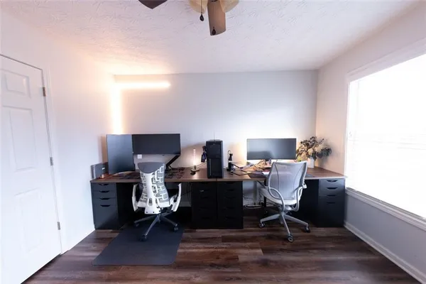 a workspace with furniture and wooden floor