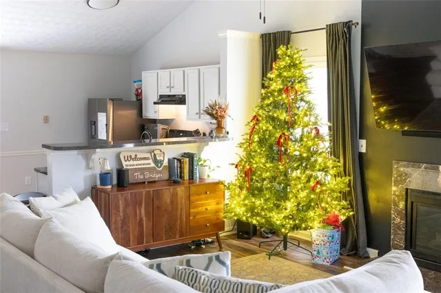 a living room with furniture and a flat screen tv