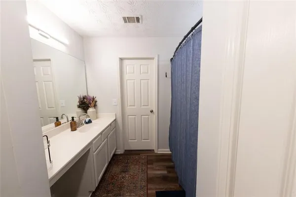 a bathroom with a double vanity sink and mirror