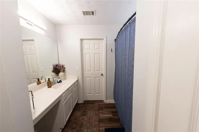 a bathroom with a double vanity sink and mirror