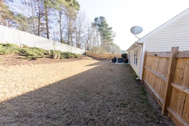 a view of a house with a snow in the yard