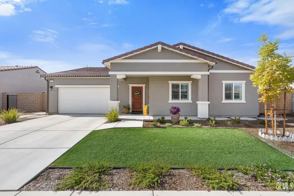 a view of a front door and potted plants