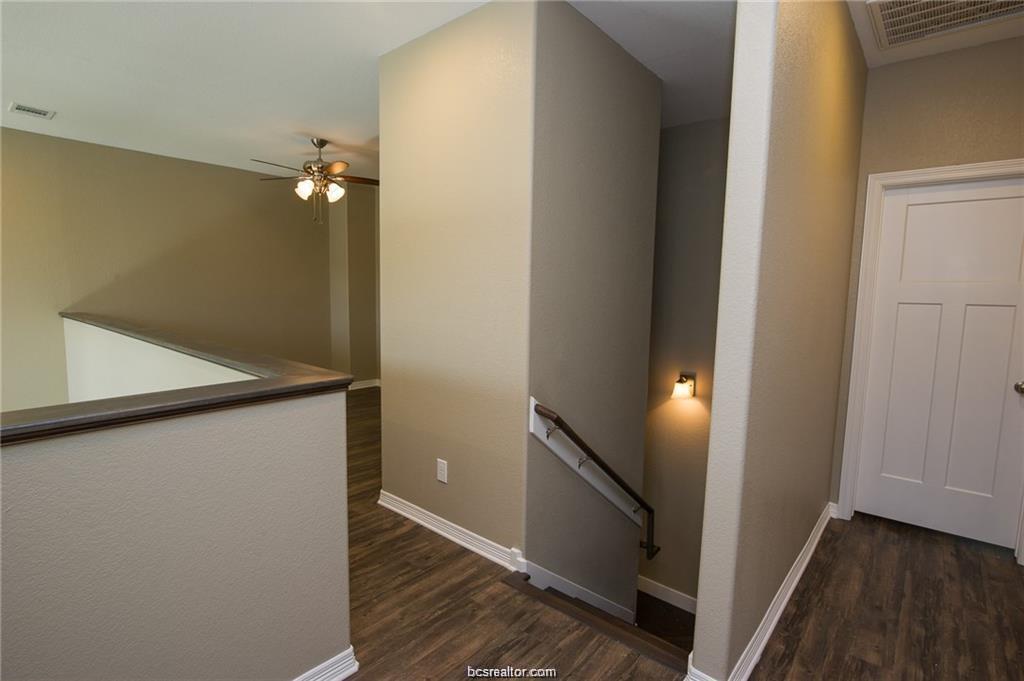 3200 Link Street Bryan, TX 77801 - Photo 13 of 24 a view of a hallway with wooden floor