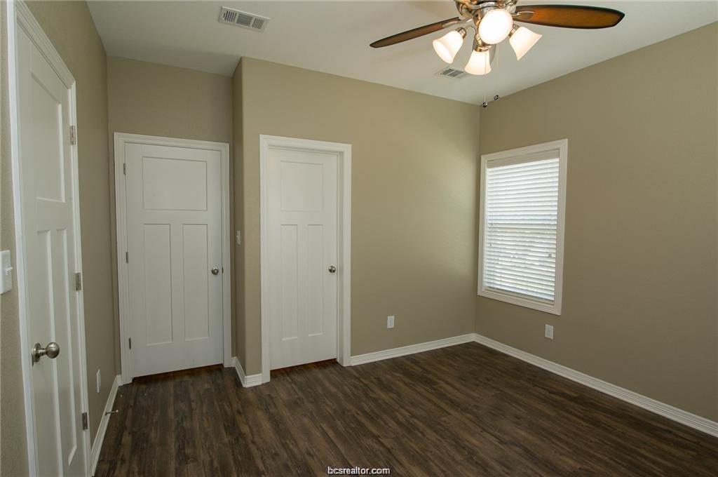 3200 Link Street Bryan, TX 77801 - Photo 18 of 24 a view of an empty room with wooden floor and a window