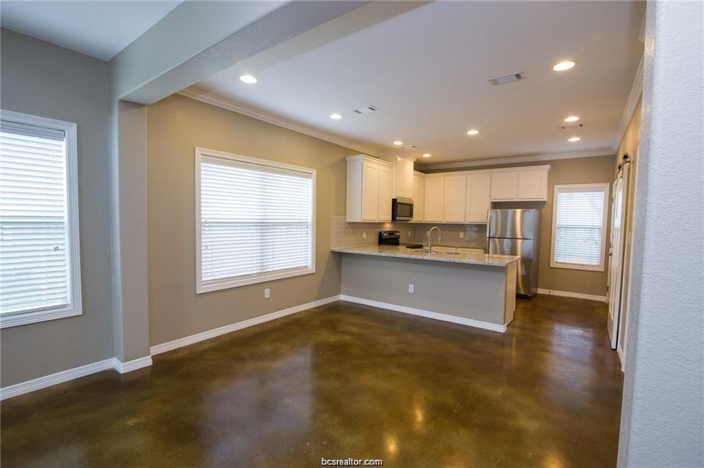 3200 Link Street Bryan, TX 77801 - Photo 2 of 24 a large kitchen with stainless steel appliances granite countertop a large counter top a refrigerator and a sink