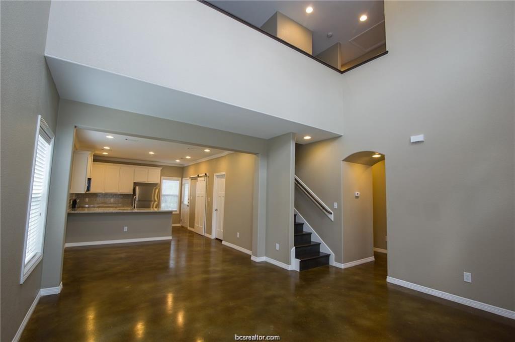 3200 Link Street Bryan, TX 77801 - Photo 4 of 24 a view of a living room with furniture and floor to ceiling window