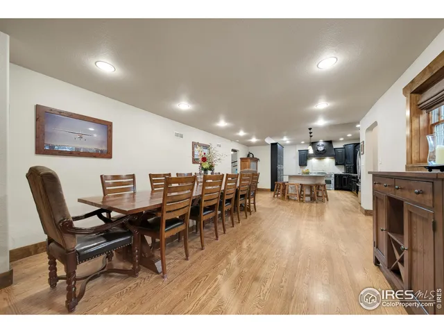 a living room with lots of furniture and kitchen view