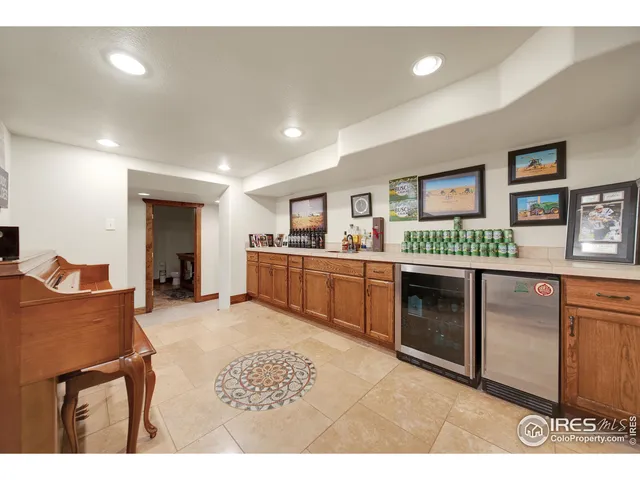 a view of a kitchen with stainless steel appliances granite countertop a stove top oven
