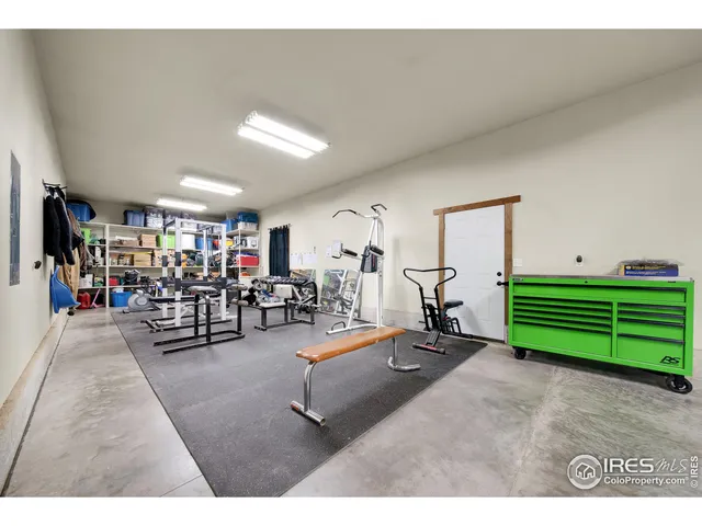 a living room with lots of furniture and a wooden floor