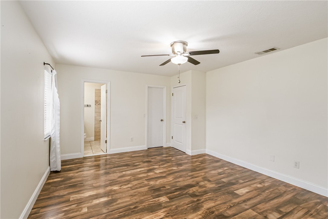 1121 Clearmont Street Sebastian, FL 32958 - Photo 19 of 31 a view of room with a ceiling fan and hardwood floor