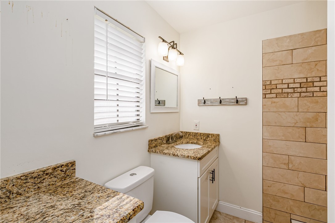 1121 Clearmont Street Sebastian, FL 32958 - Photo 21 of 31 a bathroom with a sink a toilet and shower
