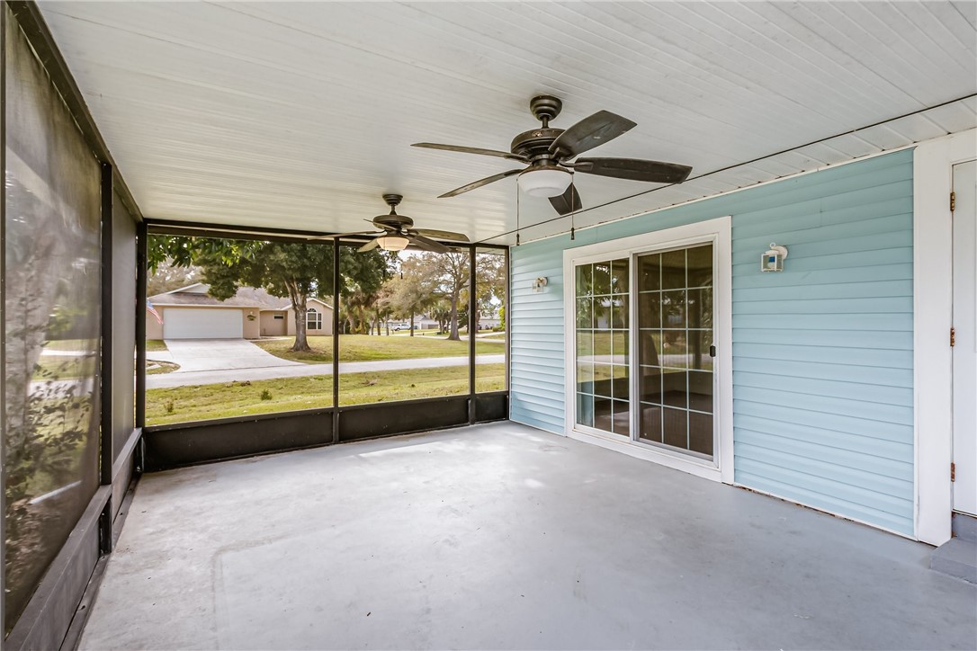 1121 Clearmont Street Sebastian, FL 32958 - Photo 26 of 31 a view of a livingroom with a ceiling fan and window